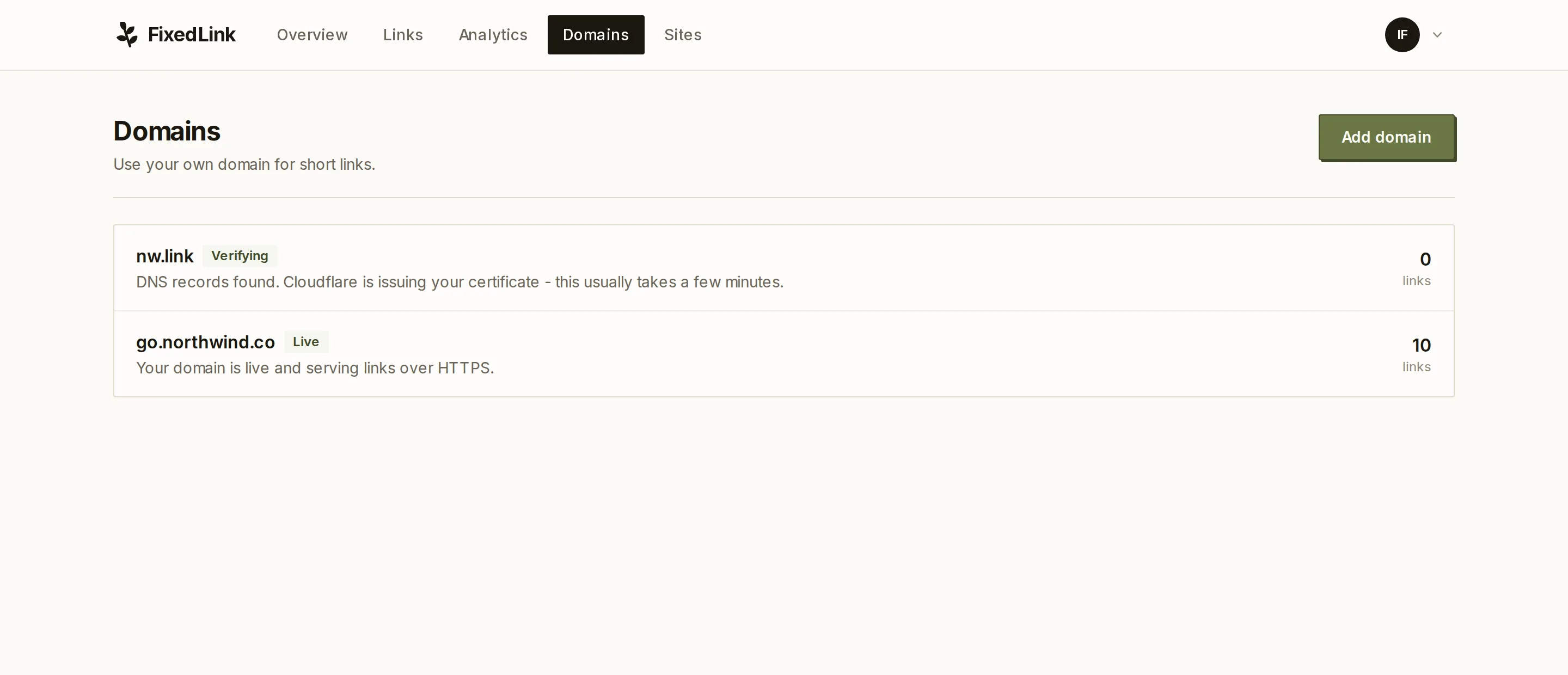 The domains page, with one domain live and another waiting on DNS verification